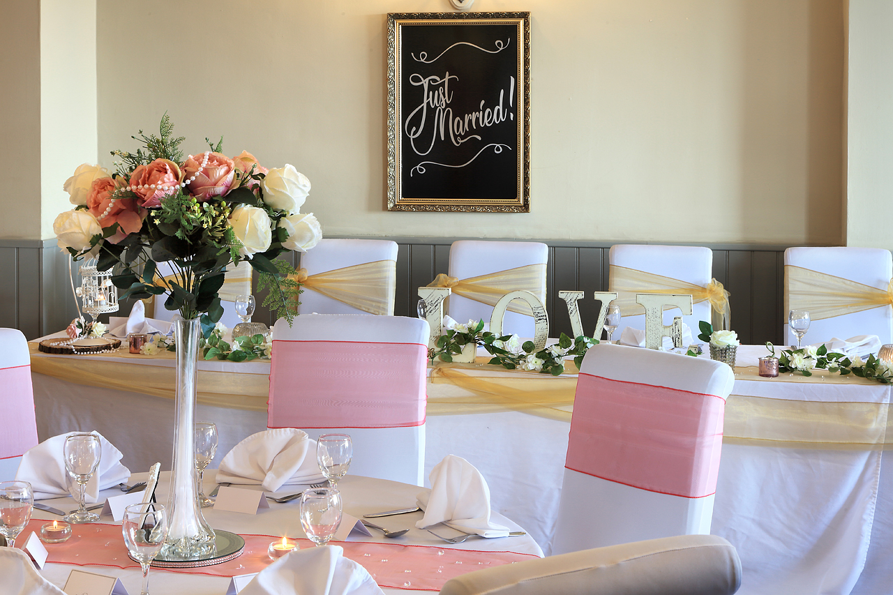 Wedding breakfast table setting, centering flowers